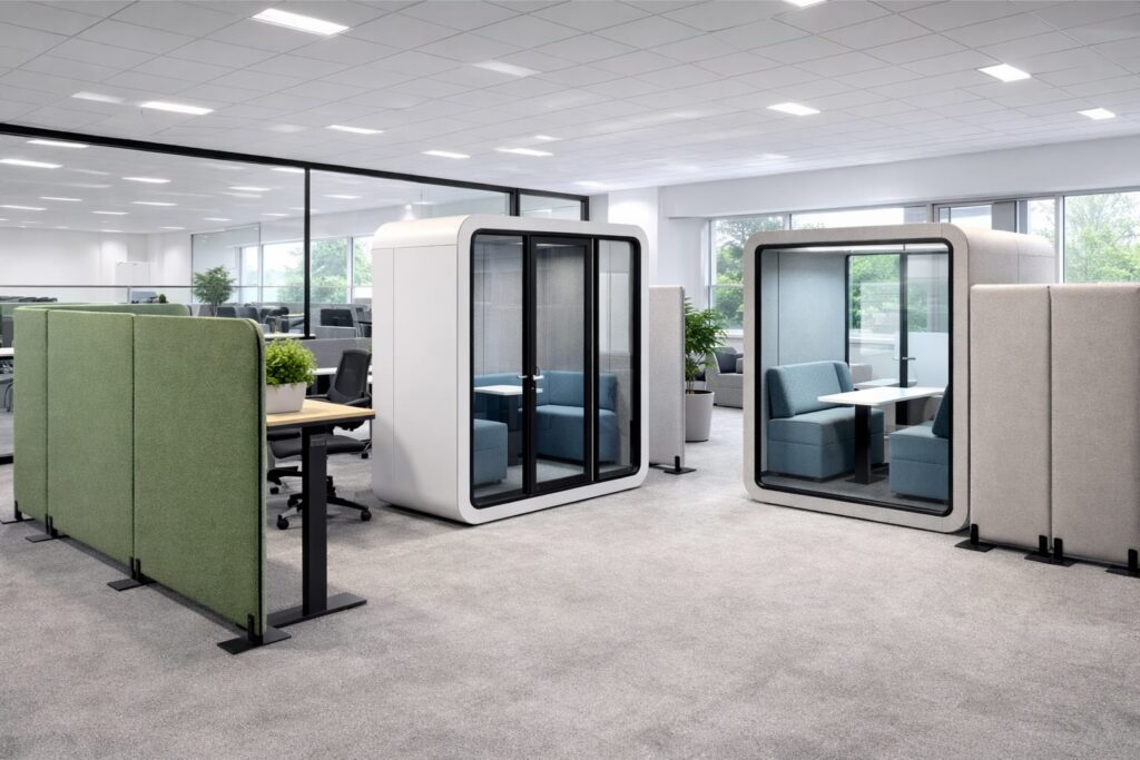 A modern office with distinct zones created by stylish office dividing screens and acoustic pods.