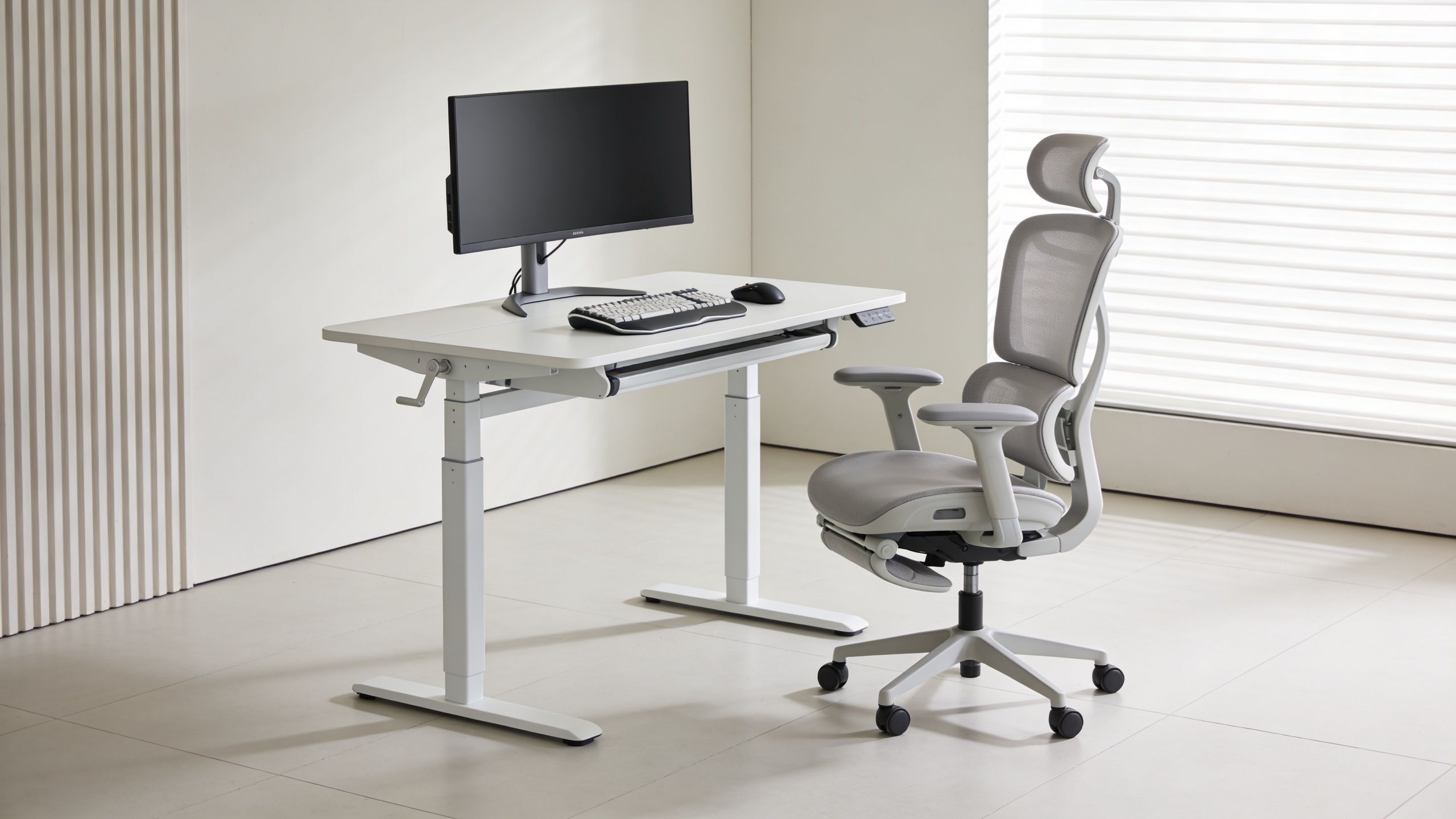A modern white ergonomic home office setup with a height-adjustable desk and an adjustable office chair.